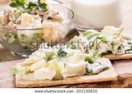 Healthy fish egg veg salad with garlic souse put on the crispbread