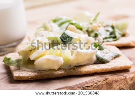 Healthy fish egg veg salad with garlic souse put on the crispbread