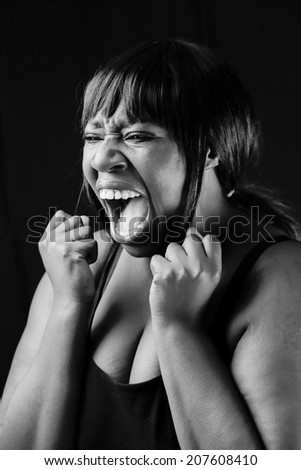 Young African woman acting as someone in pain or sad