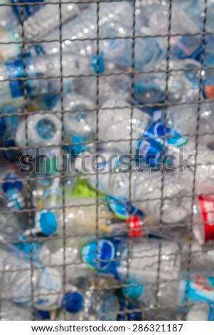 recycle bin filled with plastic bottle blurry filter