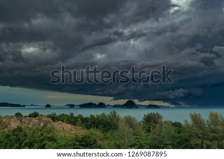 Dramatic stormy cloud sky above Krabi Thailand islands in turquoise sea. Storm in Thailand. Tropical Storm Pabuk.