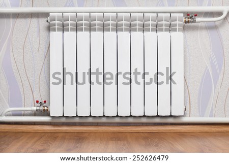 Heating radiator in room. Design of interiors