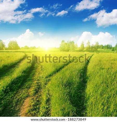 Two country roads and blue sky with sunlight.