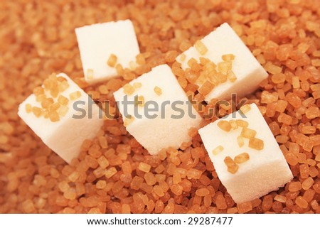 White sugar cubes and brown sugar.