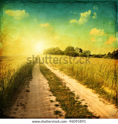 Retro image of country road at sunset.