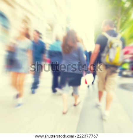 Image of motion blurred people in the city.