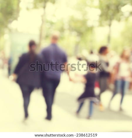 Abstract blurred image of people in the city.