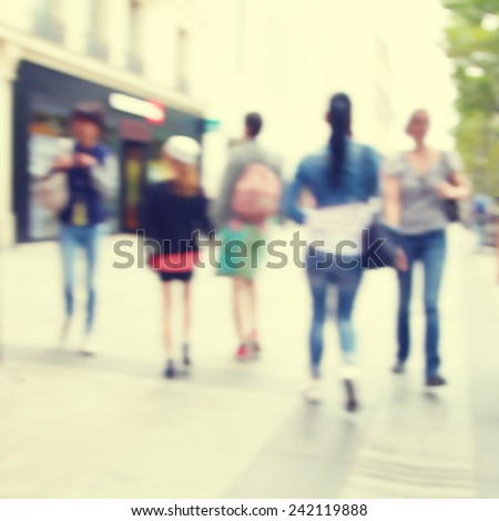 Abstract blurred image of people in the city.
