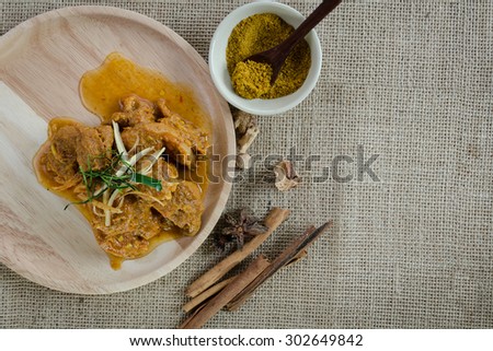 Indian Curry food served on wood dish with curry powder