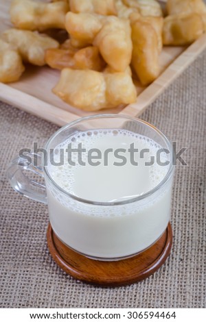 closeup shot Soybean Milk in Glass with fried bread stick