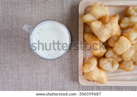 top view A glass of soya milk and beans with fried bread stick