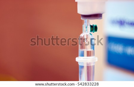close up saline drop and medical intravenous drip  to replace liquid in patients in surgery in operating emergency room in hospital