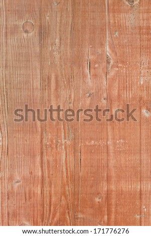 Wooden pine boards lying together in brown color with lines and annual rings