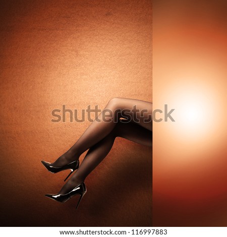 Woman\'s Legs Wearing Pantyhose and High Heels