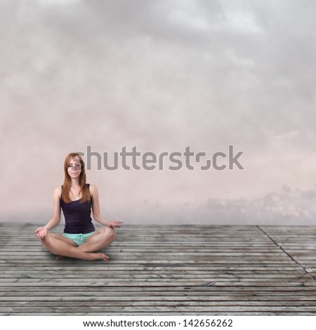 Girl meditating at the calm place