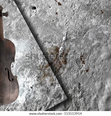 Old broken violin on the rusty background