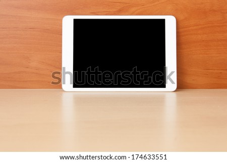 Tablet on the table with blank screen