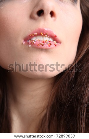 Woman open mouth with beads