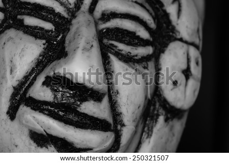 Inca face shown as a small sculpture