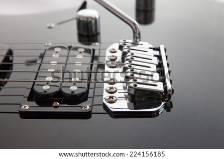 Electric Guitar strings and pickup closeup
