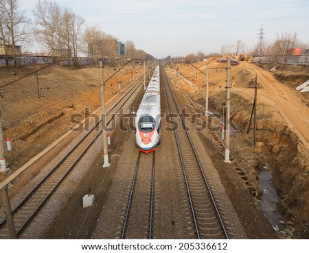 Khimki, Russia - March 30, 2014: The high-speed train moves on a railroad line