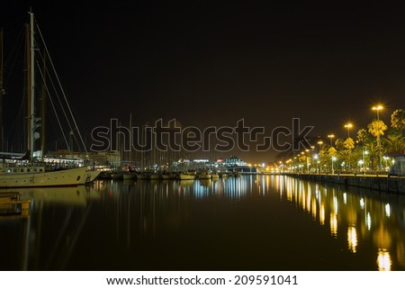 Barcelona, Spain - August 29, 2013: Night Embankment with the ship to the Port Olimpik in Barcelona, Spain