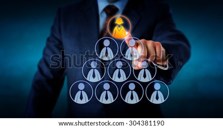 Torso of a human resources manager is selecting a female office worker atop a pyramid made out of otherwise male employee icons. Business metaphor for leadership, headhunting and career success.