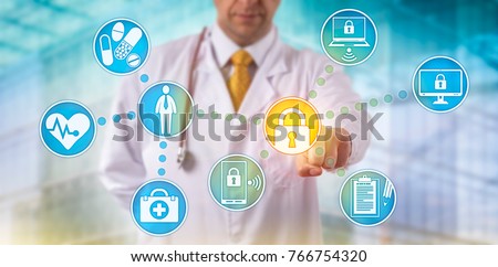 Unrecognizable doctor of medicine securing patient medical records across multiple devices via a computer network. Healthcare IT concept for security of health information exchange and data privacy.