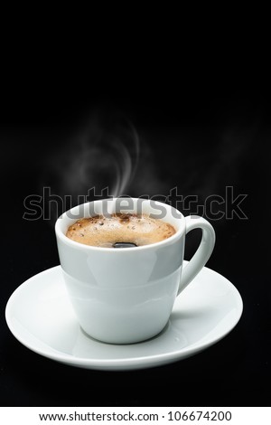 Steam coming out of coffee cup, on a dark background