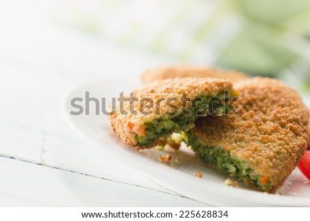 Spinach croquettes prepared from dough made of spinach, cheese and spices, all wrapped in bread crumbs
