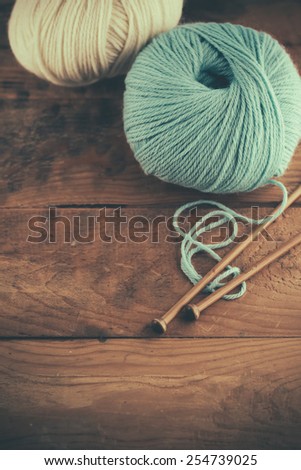Ball of wool on wooden background, old retro vintage style