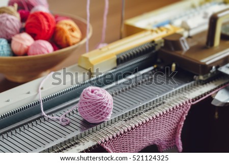Hand Knitting Machine. A knitting machine is a device used to create knitted fabrics in a semi or fully automated fashion.