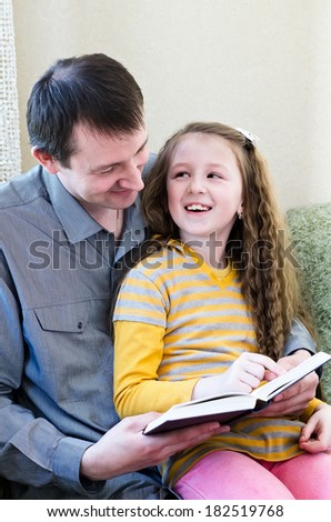 the father and the daughter with the book