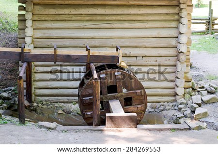 Wooden wheel of an ancient water mill in open-air museum,Ukraine.Lvov