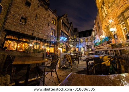 Restaurant tables in a charming old European town decorated for Christmas