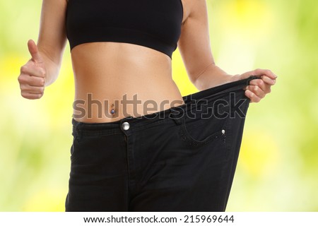 Young woman on diets thumb up