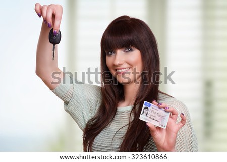 Laughing woman with car keys