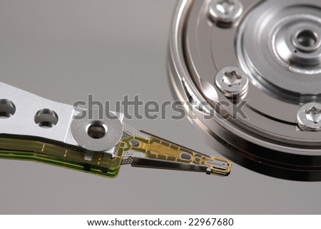 Close-up of a hard drive needle with reflection top view