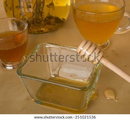 Greek cold herbal tea with honey from the island of Crete in a transparent glass dishes