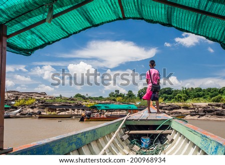 children guide on the boat and blue sky