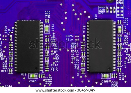 Power of technology: two chips on violet circuit board