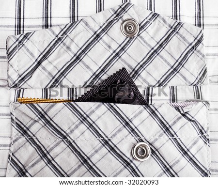 Ready to date: condoms in shirt pocket close-up