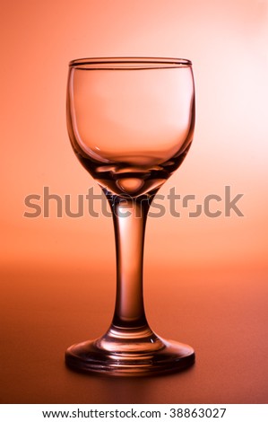 Evening drink - glass of wine in orange and brown tones