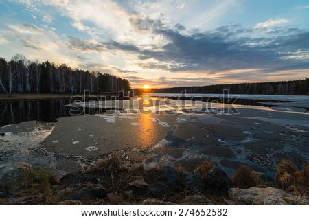 Thawed ice on lake in the spring on a decline, Ural Mountains, Russia