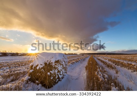 panorama rural field with haystack and the first snow in Russia, Ural