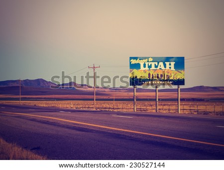 utah state line welcome sign with open landscape with retro instagram filter