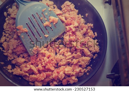 breakfast sausage in a skillet on a vintage range with a retro instagram filter