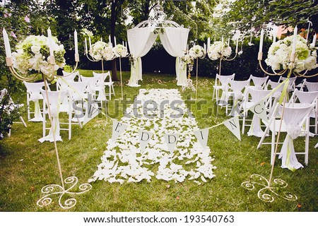 Beautiful wedding  arrangement of seats along the aisle