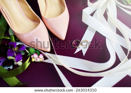 Wedding rings , bouquet and pink shoes composition. Marriage  mood. Morning bride.  Groom\'s boutonniere.
