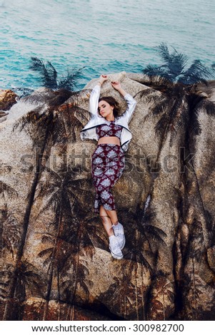 Creative double exposure fashion  portrait of attractive  stylish woman combined with photograph of nature and ocean.